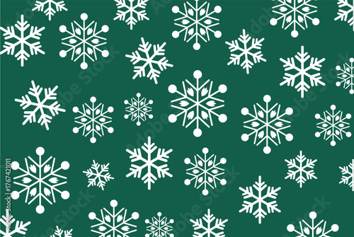 Seamless pattern of various sized white snowflakes on a deep forest green background. High-contrast vector ideal for Christmas backgrounds, winter wrapping paper, and holiday design.