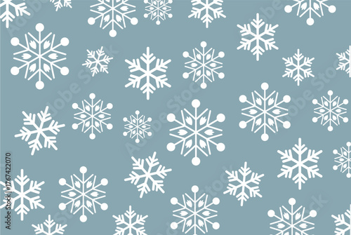 Muted blue-gray background with a scattered pattern of various sized white snowflakes. Modern, simple vector design perfect for winter backgrounds and holiday graphic assets.