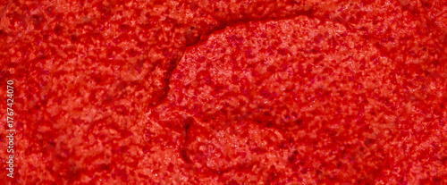 Red berry yogurt ice cream. Fresh fruit smoothie with strawberries, raspberries, pomegranate and red currants. Ice cream texture. Delicious sweet dessert close-up as a background.