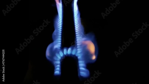 blue gas flame ignites.