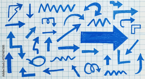 Hand-Drawn Blue Arrow Collection on Grid Paper for Directional and Navigation Concepts