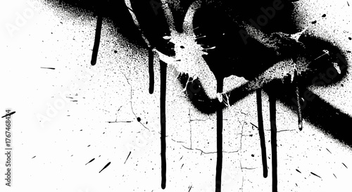Abstract graffiti drips on a white wall creating a striking black and white pattern