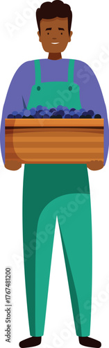 Smiling farmer carrying a wooden crate full of freshly picked grapes, celebrating a successful harvest