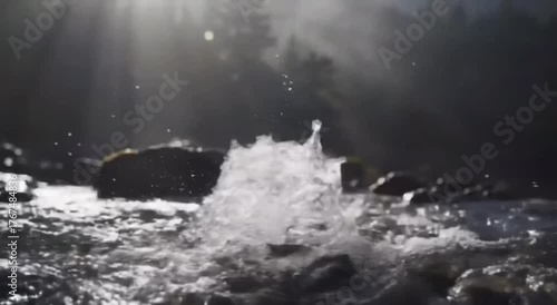 Wallpaper Mural Dynamic water splash in a sunlit river with rays of light filtering through distant trees and rocks. Torontodigital.ca