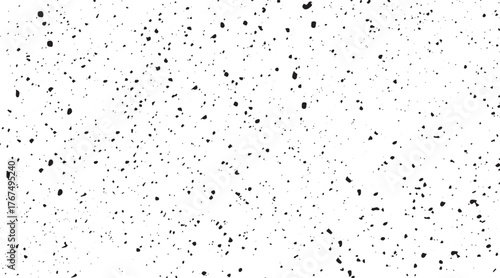 A monochrome abstract pattern of gray dots fading from dense to sparse on a white background.