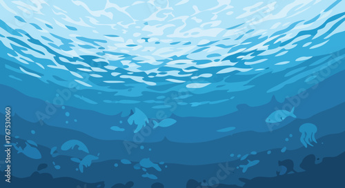 A tranquil underwater view of fish swimming in the ocean.