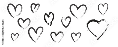 A scattering of hand drawn hearts in a simple black and white style