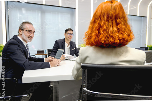 Group of diverse businesspeople at conference, happy business workers discussing and brainstorming together at meeting room. Cheerful officers exchange ideas and listen to presentations during meeting