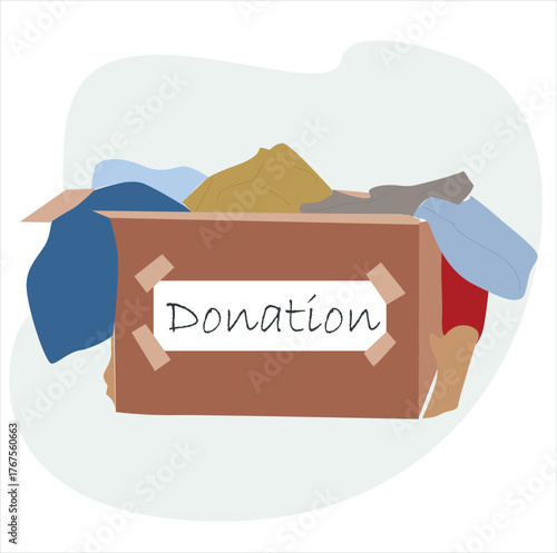donation box. Clothes donation. Cardboard box full of different things.
