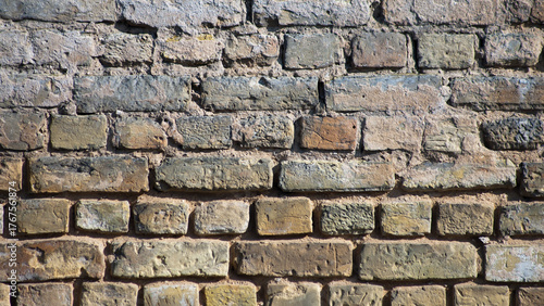 brown background, in the photo an old brick wall