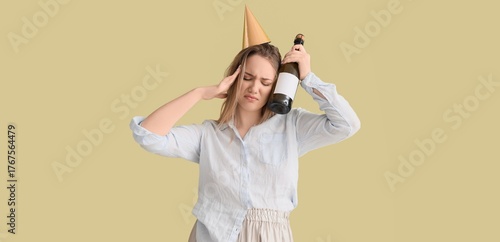 Young woman with hangover a...