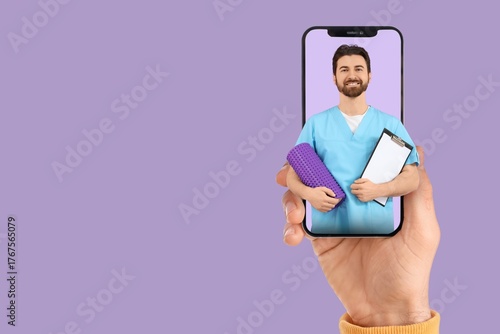 Patient holding smartphone ...