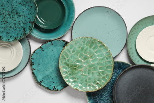 Set of green plates on whit...