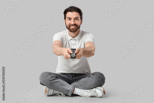 Young man with remote contr...