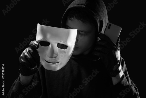 Male fraudster with mask an...