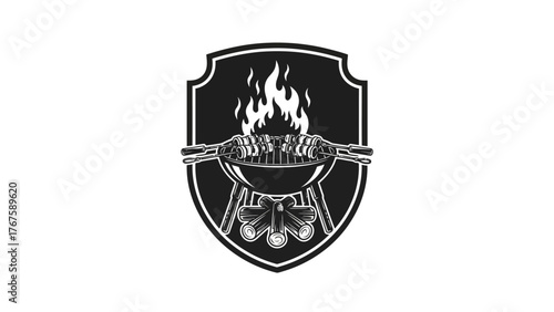 A barbecue scene. A shield with a grill, fire, and skewers. Logs are at the bottom