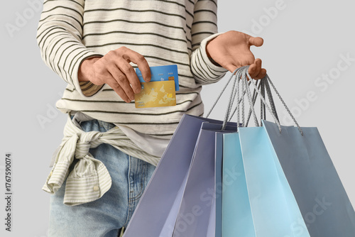 Young man with shopping bag...