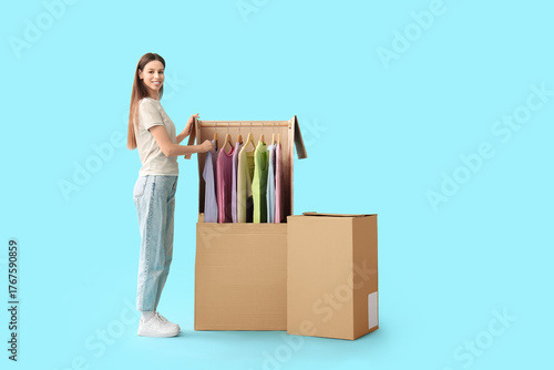 Young woman and wardrobe bo...