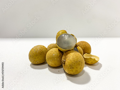 Fresh longan fruit isolated on white background. Tropical exotic fruit minimal still life. Organic longan close up. Sweet healthy fruit photography. Natural clean food concept.