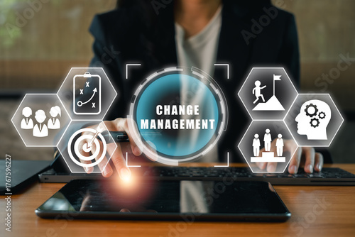 Visual representation of change management with digital icons and a professional using a tablet, symbolizing strategy and innovation.
