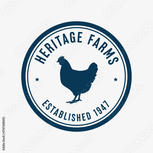 A dark blue circular logo featuring a stylized chicken silhouette within a frame with text