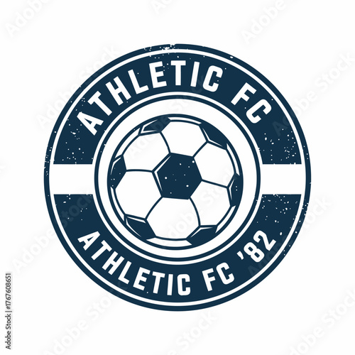 Circular emblem featuring a soccer ball, enclosed by text, with a vintage, slightly distressed design