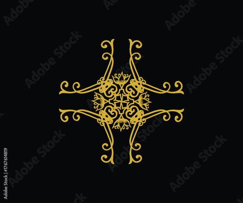 Ornate golden decorative element with swirls and filigree