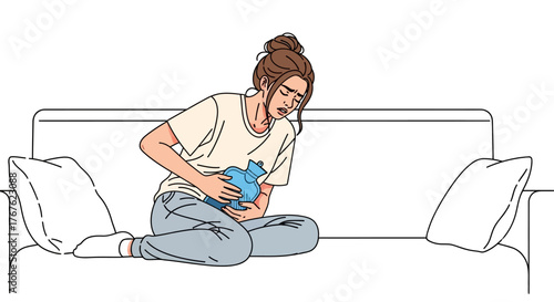 Woman with abdominal pain holding a hot water bag on the couch