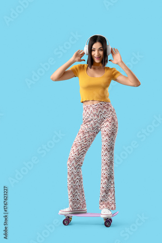 Young woman in headphones w...