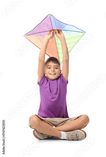 Little boy with kite sittin...