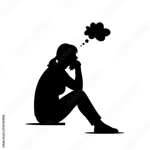 Silhouette of woman sitting with hand on chin in deep thought  
