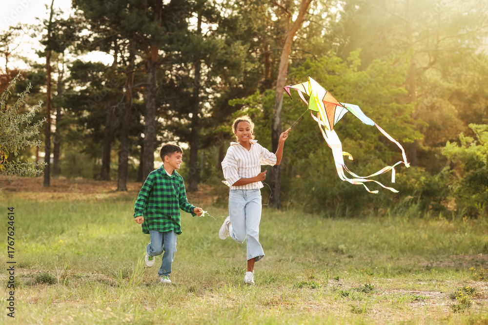 Fototapeta premium Children with kite running in park