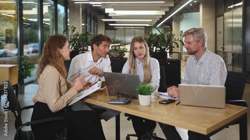 Group of happy progressive business people working on startup together at creative office