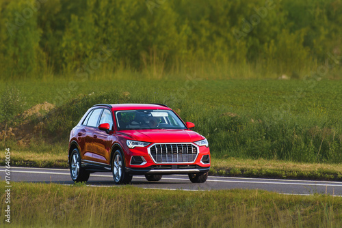 Photography Compact crossover driving on countryside road