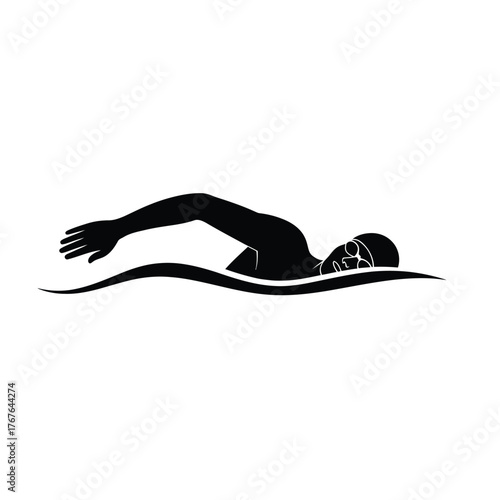 Silhouette of a swimmer performing freestyle stroke in water