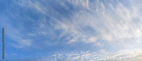 Layered Clouds in the Blue Sky.Sunset Glowing