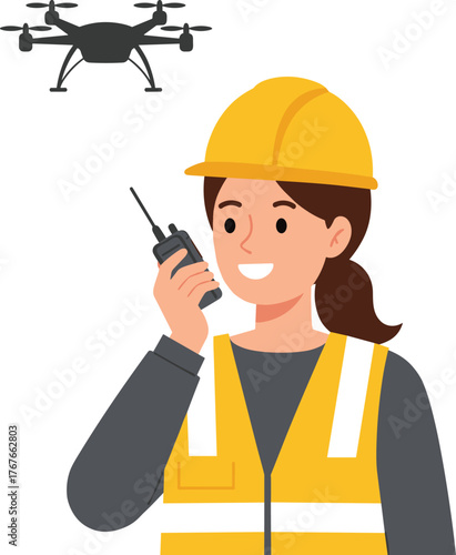 Smiling female construction worker or engineer in safety vest and hard hat, using a walkie-talkie to communicate while a drone flies overhead for site inspection and surveying technology.