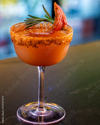 Spicy Margarita with Tajín Rim and Grapefruit Garnish on Bar Counter