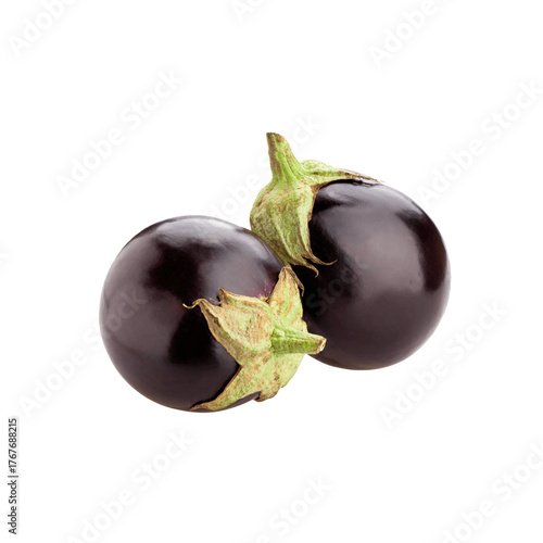 Two glossy ripe dark purple eggplants with vibrant green stems are artfully arranged against a stark black background
