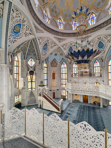  Kazan Kremlin, Kazan, Russia, July 26,2024: Kul Sharif Mosque, the main prayer hall with its huge blue-and-gold chandelier, Islamic geometric patterns, and stained-glass windows.