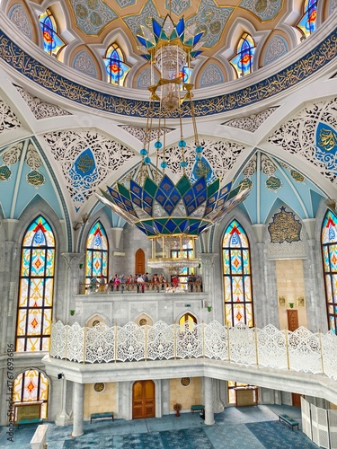 Kazan Kremlin, Kazan, Russia, July 26,2024: Kul Sharif Mosque, the main prayer hall with its huge blue-and-gold chandelier, Islamic geometric patterns, and stained-glass windows.