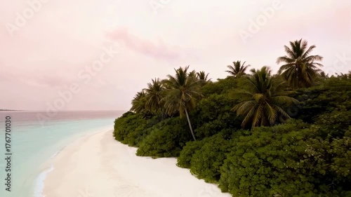 Idyllic Tropical Island Beach Paradise With Lush Green Palm Trees and Turquoise Ocean Water Under a Soft Pink Sky