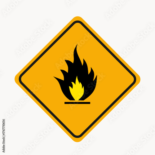 Warning sign depicting fire, alerting drivers to the presence of flammable materials that may ignite and cause a fire hazard