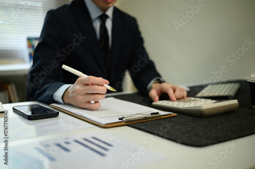 Cropped image of a business finance expert working on balance sheets, managing budgets, and verifying accounting records efficiently