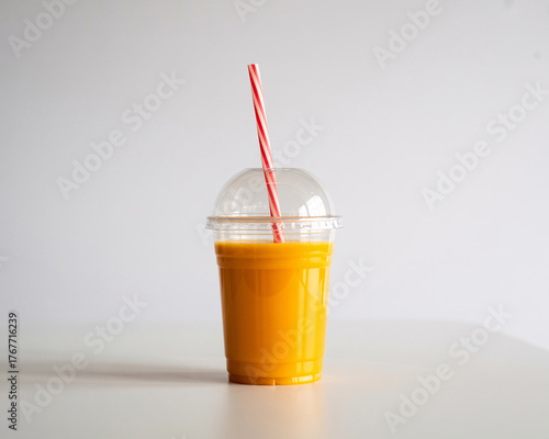 Refreshing mango smoothie with vibrant color ready to enjoy for a healthy start to your day on white background