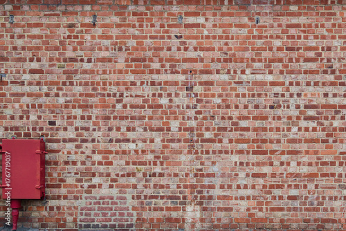 Brick wall background texture with red box in the corner