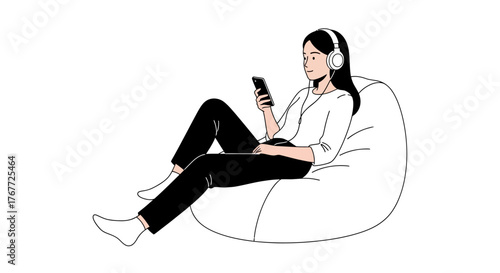 Woman relaxing on beanbag chair with headphones while browsing on smartphone device