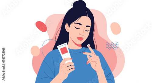 Young woman applying cream to her face with her finger from a tube.