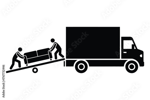 Movers loading a sofa onto a truck using a ramp
