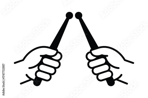 Hands holding drumsticks ready to play